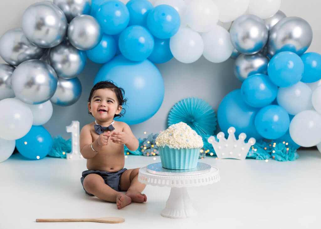 Blue balloon themed first birthday set with baby boy Cake Smash Photography West Bromwich Birmingham