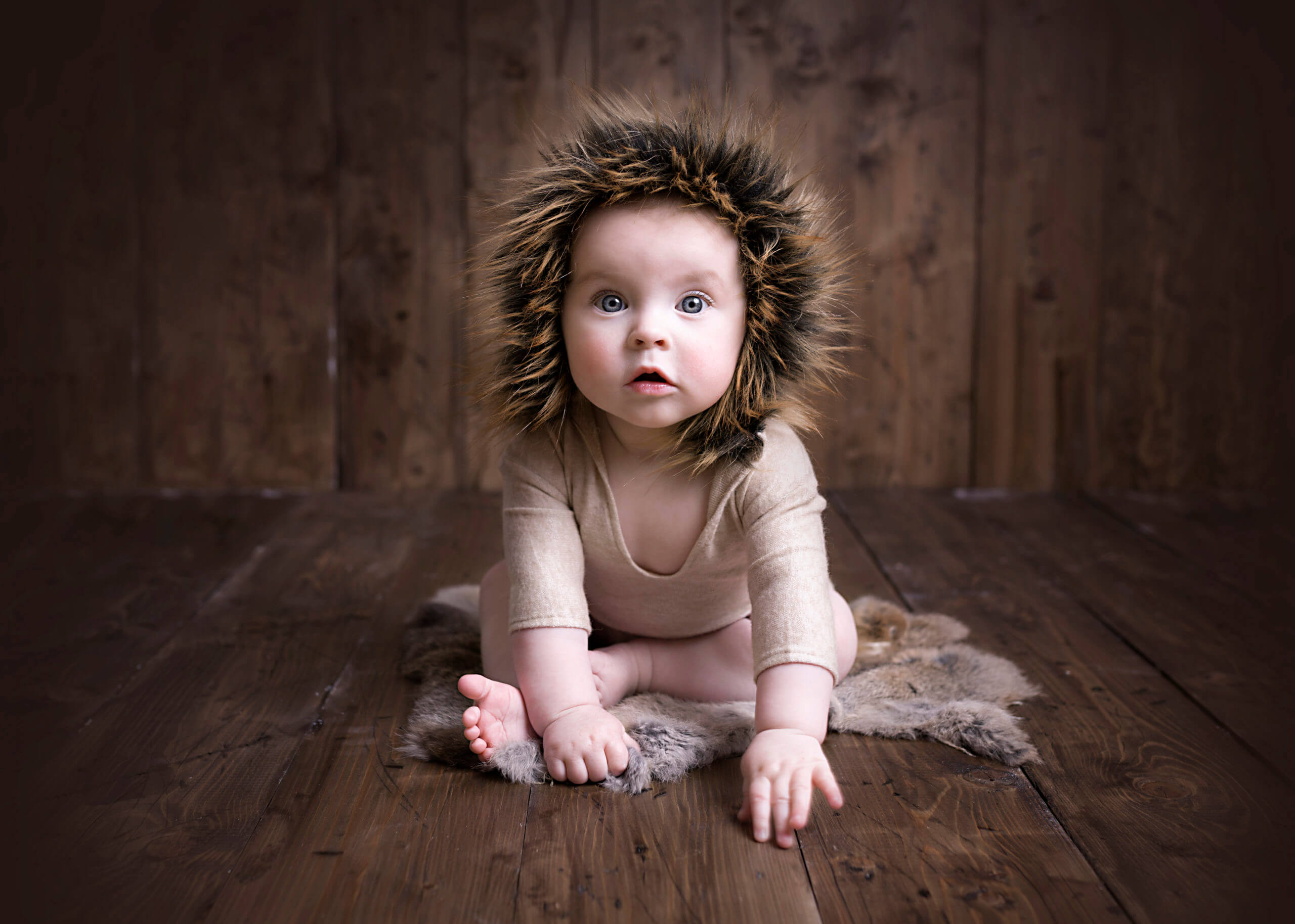 baby sat in a fur outfit, Baby Photographer Sutton Coldfield Birmingham